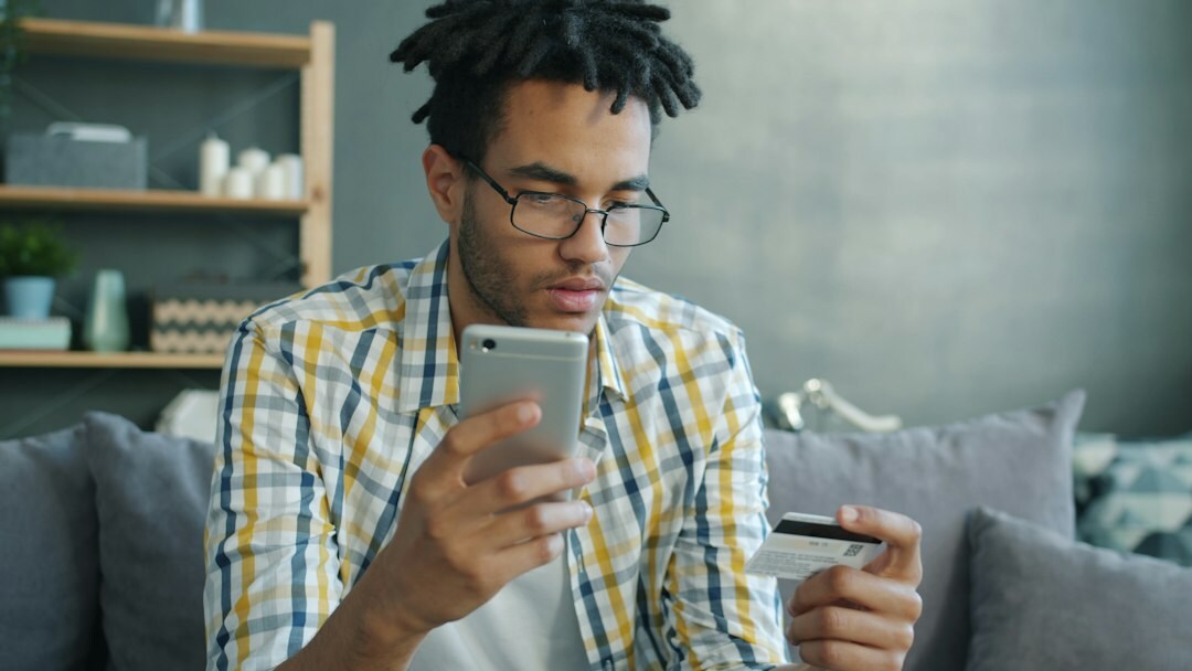 Young professional studying finance materials at home
