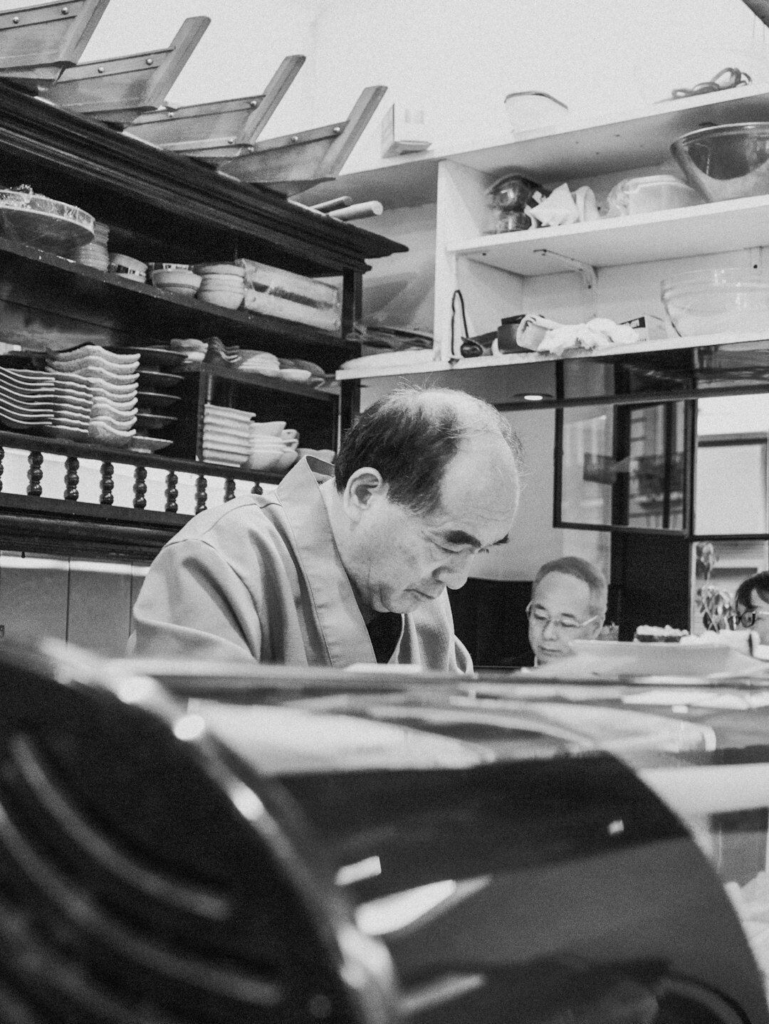 Financial advisor reviewing charts with a client at a desk