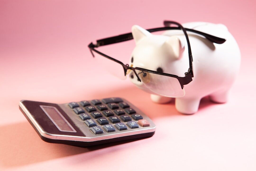 person saving money in piggy bank